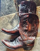 Full side view of both boots showing shaft stitching and overall condition