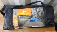 Front of carry bag showing Ozark Trail branding and specifications