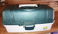 closed tackle box showing exterior, latch, logo