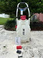 Front view of Agri Ease wheeled sprayer with accessories arranged