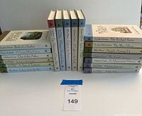 Three stacks of Guideposts hardcover mystery novels with lot tag visible