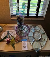 Entire lot grouped on tabletop showing vase, suncatcher, plate, stems and doily