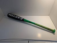 Full view of Easton black and green baseball bat