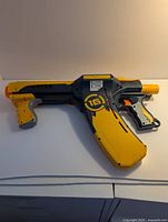 Right side of Nerf Quick 16 blaster showing integrated curved clip and colour scheme