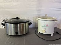 Both slow cookers side by side showing overall condition and size comparison