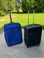 Front view of both suitcases showing design, colors and handles
