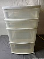 Front view of four-drawer clear plastic tower