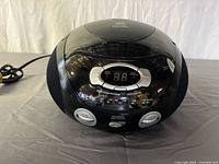 Front view showing control panel, speakers and display