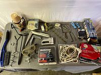 Overall view of all garage items spread on table