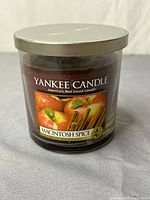 Front view showing Yankee Candle Macintosh Spice label on glass jar