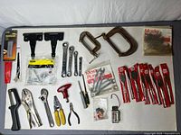 Overview of all tools, clamps, blades, hinges and hardware laid out