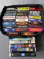 Tray of VHS tapes plus separate stack showing overall quantity