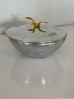 Dish with lid closed showing bird finial