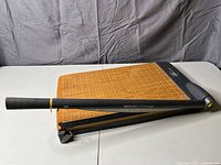 Full view of trimmer closed showing cutting arm and base