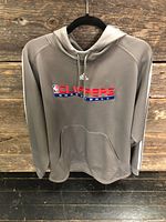 Front view of grey Adidas Clippers hoodie on hanger