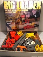 Front of box and contents visible in tray