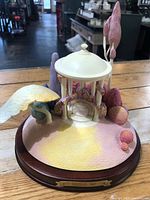 Full view of Walt Disney Enchanted Places Fantasia sculpture on wood base