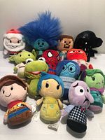Group shot of all 13 Hallmark itty bittys plush figures
