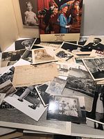 Overview of assorted photographs, colour magazine page, telegram