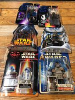 Group shot of all six sealed figures on various card styles