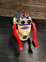 Front view of Tomy Armstrong ride-on robot