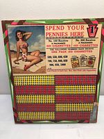 Full front view of punchboard showing pin-up art, punch field and prize legend