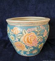 front view of floral painted ceramic pot