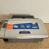 Top view of Epson Stylus CX5000 showing overall condition and attached power cord