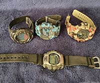 Group shot of four digital wristwatches