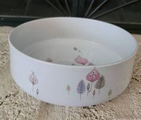 Side view showing bowl shape and exterior motif