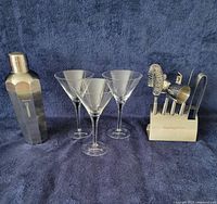 Full set: shaker, three martini glasses, broken glass stem parts, utensil holder with tools