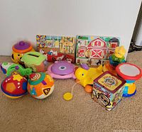 Group view of all toddler toys, puzzles, and tin