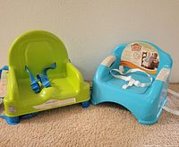 Front view showing both booster seats, harnesses visible