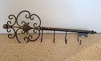 Full view of skeleton key-shaped wall rack with hooks