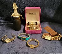 Group of six women’s watches with boxes and accessories
