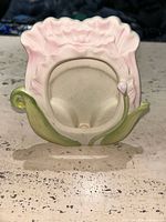 Front view showing pink flower design and oval photo opening