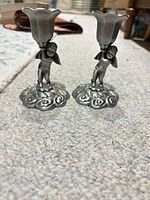 Front view pair cherub candle holders