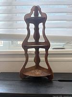 overall view of wooden three-tier corner shelf