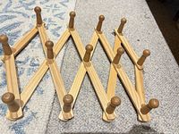 Peg rack expanded showing wood slats and pegs