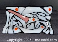 Front view showing abstract fused glass design and colors