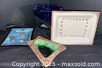 Group view of four ashtrays/trinket dishes