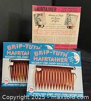 Front view showing two blue Grip-Tuth Hairtainer comb cards and one additional card behind