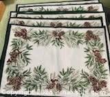 Front view showing pinecone and evergreen design on all placemats