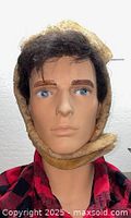 Front view of tan shearling trapper hat on mannequin head