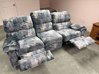 Front view of 3-seat Elran sofa with two recliners extended