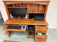 Front view showing keyboard tray, drawers, CPU cabinet, hutch cubbies