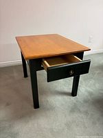 Rectangular wood end table with drawer open