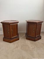 Both hexagonal end tables closed, showing wood finish and hardware