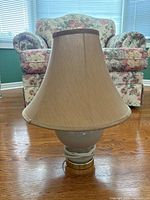 Front view of table lamp showing shade, base, cord