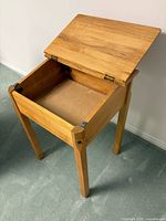 Desk with top open showing interior storage